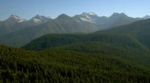 Aerial Of High Mountain Forests And Peaks