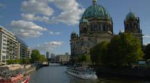 Boats Pass Berlin Cathedral And The Spree River