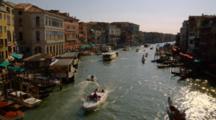Boats Travel Down Canal In Venice
