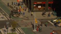 People Cross A Downtown Intersection In New York City