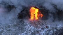 Aerial Of Molten Lava Flowing Into Ocean, Steam