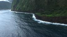Aerial View Of Hawaii Coastline With Black Sand And Waterfall