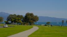 People Enjoy Shoreline Park, Sailboats In Distance, Santa Barbara