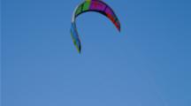 Kiteboarding At Huntington Beach Pier, Focus On Colorful Kites In Blue Sky