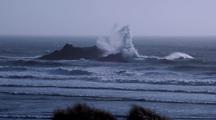 Waves Crash On Offshore Rocks