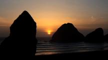 Rocky Outcroppings Create Sunset  Silhouette