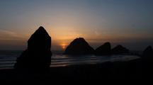 Rocky Outcroppings Create Sunset  Silhouette