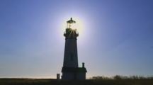 Lighthouse On Rugged Coast