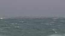 Lockoff Shot Of Rough Choppy Ocean Waves During A Storm With Mist Coming Off Of The Water.