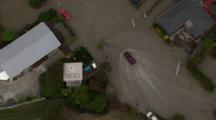 Aerial Christchurch Earthquake, Car Drives Through Flooded Suburban Street