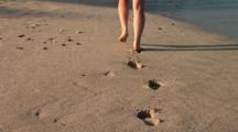 Woman Walking Alone On The Beach, Leaves Footprints, Big Island, Hawaii