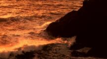 Waves Roll In At Sunset Along The Rocky Oregon Coast