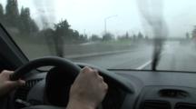 Woman Driving Car Through The Rain On A Highway, Windshield Wipers Working, Portland, Oregon