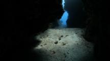Pov Travel Through Swim Through Or Cave Toward Outer Opening, Possibly In Bahamas