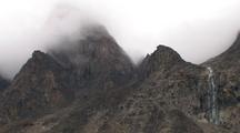 Mountain Peaks In Fog With Waterfall, Auyuittuq National Park, Baffin Island