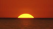 Fiery Red Cosmic Sunset Over Sea Horizon