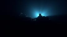 Surreal Underwater Night Diver Lights Searching And Exploring As Light Washes Over Lens 