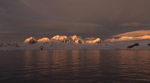 Antarctic Scenic Shoreline In Golden Light At Dusk