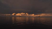 Antarctic Scenic Shoreline In Golden Light At Dusk