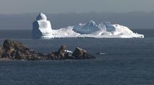 Antarctica View From Rocky Shore With Icebergs