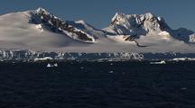 Travelling Over Water Alongside Antarctic Mountain