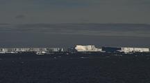 Wide Shot Antarctic Icebergs On Horizon