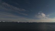 Wide Shot Antarctic Icebergs On Horizon