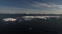Travelling Over Antarctic Ocean Towards Icebergs