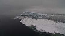 Antarctic Iceberg, Cloudy Sky, Calm Sea