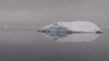 Antarctic Iceberg, Cloudy Sky, Calm Sea