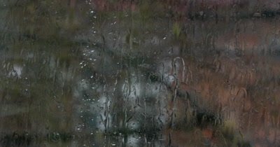 Rain drops sliding down the window glass. Water drops. Macro view