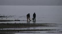 Digging For Clams In The Rain