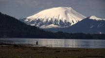 A Fly Fishermen Casts For Fish Under The Mt. Edgecumbe Volcano