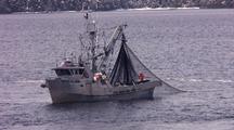 Commercial Fishing Boat  Hauling In A Purse Seine Net