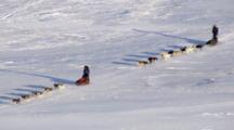 Zatzworks Cineflex Aerials Close Up Two Dog Sled Teams In Close Race Zoom To Extreme Wide Shot In Western Alaska Bering Sea Area
