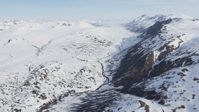 Aerial Over Frozen River,Tributaries In Snowy Mountain Range