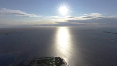 UHD aerial of the midnight sun over the Chukchi sea north slope of Alaska arctic