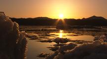 Tilt From Ice To Reveal Ice Breakup And Sunrise On Yukon River Springtime Melting End Of Winter