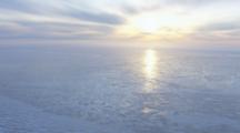Aerial Cineflex Arctic Sunrise Over Icy Water And Tundra Prudhoe Bay Arctic Ocean