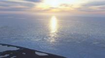 Aerial Cineflex Arctic Sunrise Over Icy Water And Tundra Prudhoe Bay Arctic Ocean