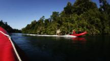 Inflatable Boats Motor Past Jungle