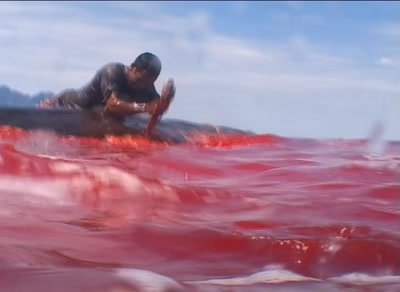 Whalehunters cutting wounds on spermwhale