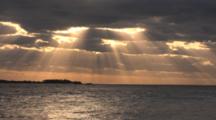 Timelapse Shot Of Light Rays Streaming Through Clouds Over Ocean