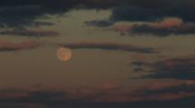 Timelapse Shot Of A Full Moon And Clouds Gliding By