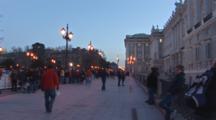 The Almudena Cathedral In Madrid Spain, People Walking By At Dusk