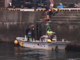 Japan - Snorkelers Unloading Boat In Japanese Marina