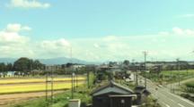 Tokyo, Japan - The Bullet Train Traveling Past Towns Near Kyoto