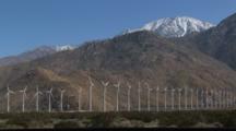 Wind Turbines And Mountains