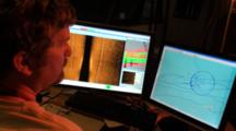Side Scan Sonar Operators Watching Displays At Night