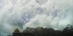 Violent Waves Crash On Rock With Kelp Swaying - Sun Glinting At Surface